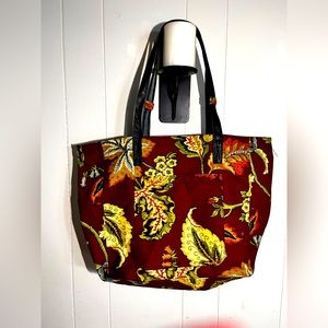 Floral canvas tote with leather straps and front pocket